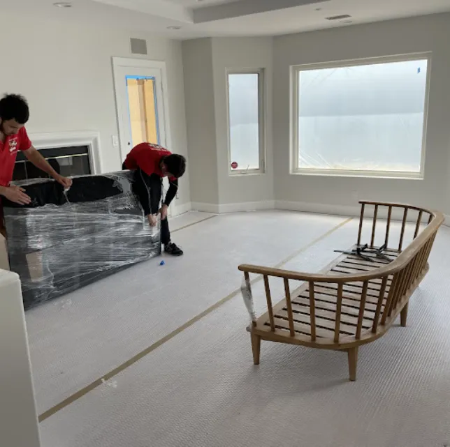 Movers packing a room