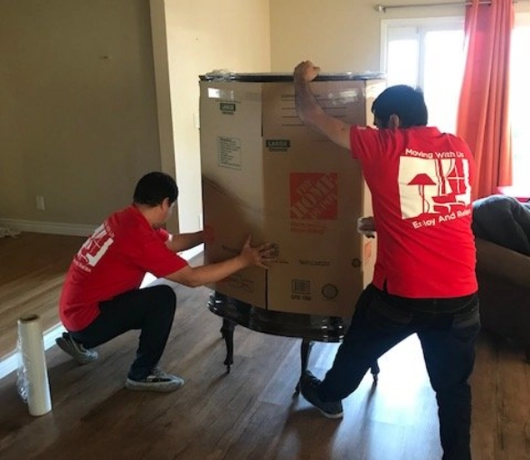 Movers wrapping an item